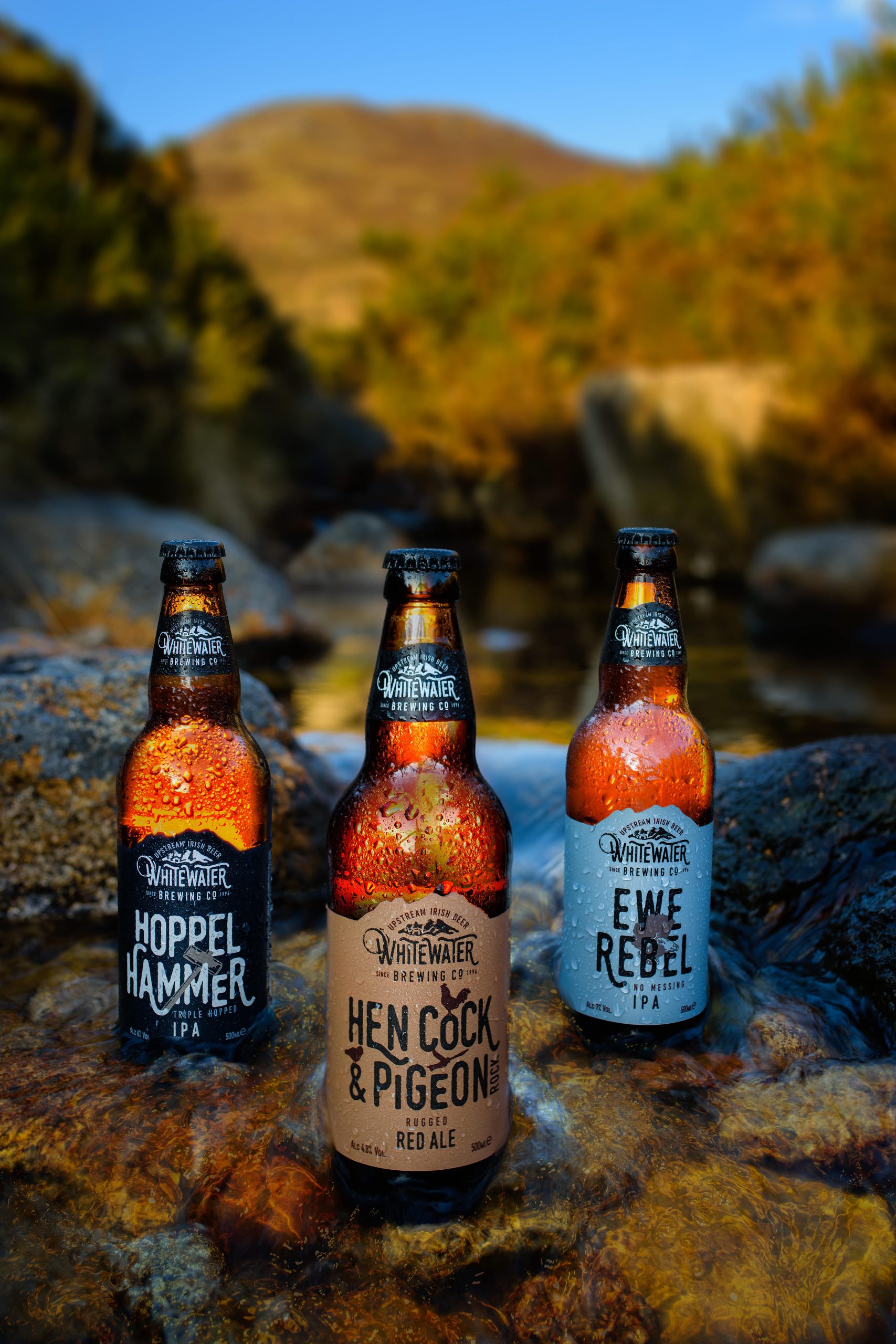 Three beautiful bottles of craft beer from Whitewater Brewing Company in Co. Down, photographed in the Mourne Mountains. High-end product photography on location.
